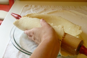 slide pie crust into pie plate
